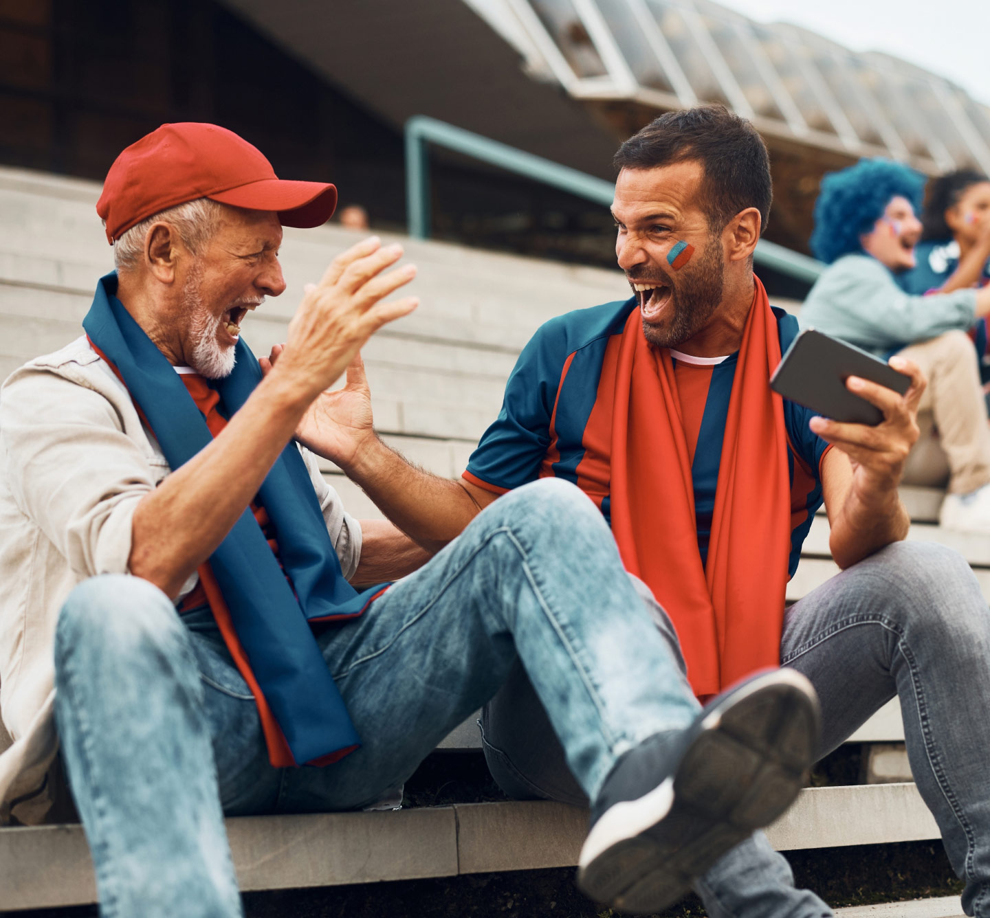 Men at game celebrate win